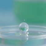 Oral insulin pill dissolving, releasing particles.